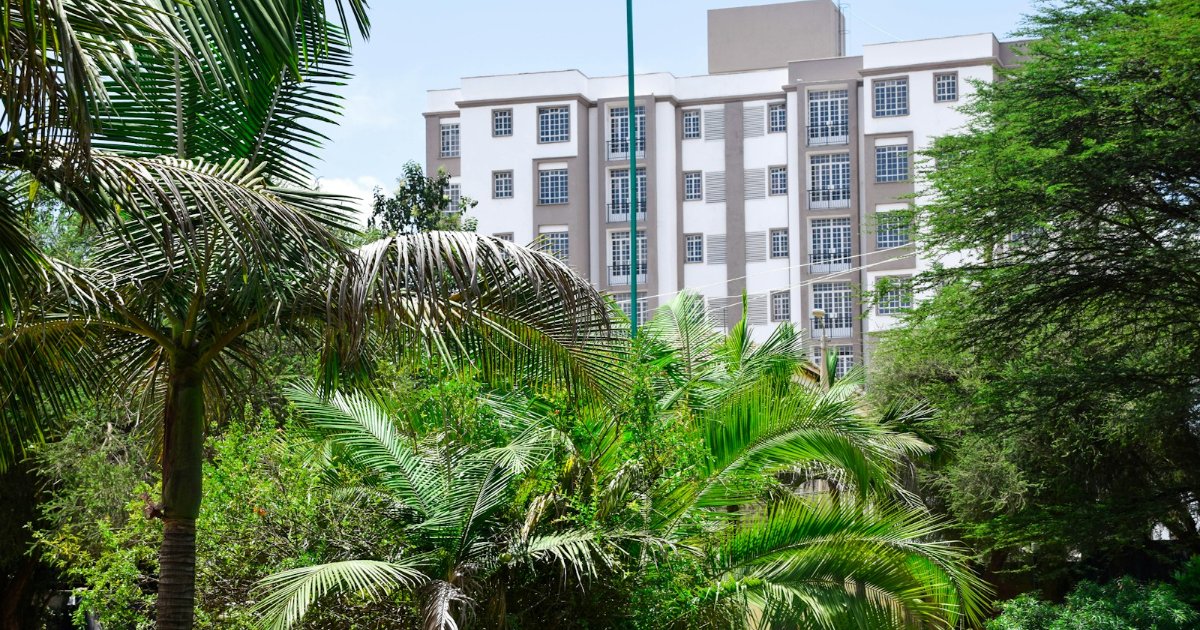 Modern apartment buildings surrounded by greenery in Nairobi, Kenya